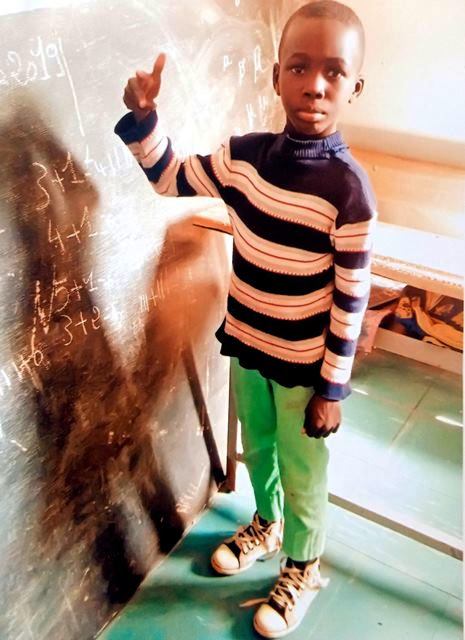 Photo d'un enfant au tableau 